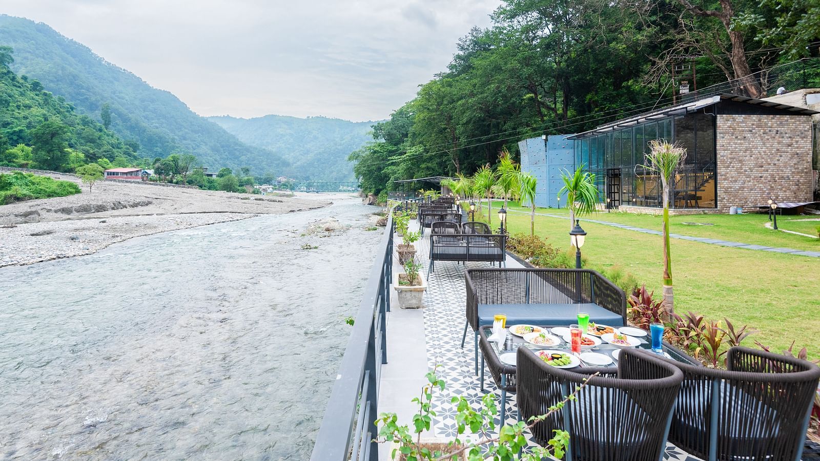 Restaurant dining area at DLS Divine River Resort and Spa featuring stunning views o f the river